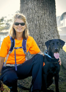 Kim and Seamus resting by a tree